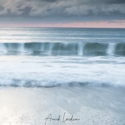 Vagues au coucher de soleil
